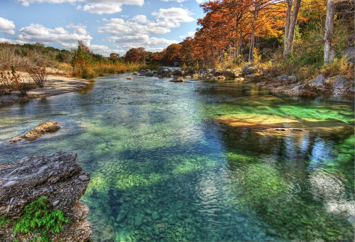 Autumn trees line the Frio River in Texas