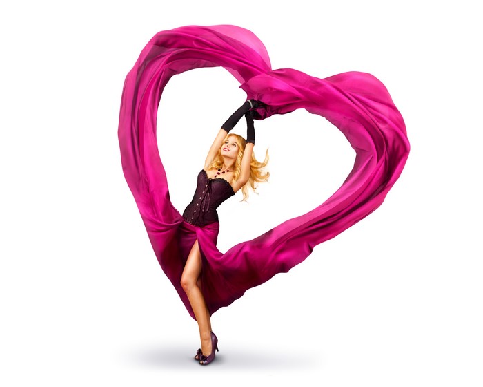Blonde girl in a corset and dress with a pink heart fabric