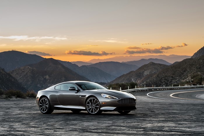 Aston Martin DB9 GT on a mountain road at sunset