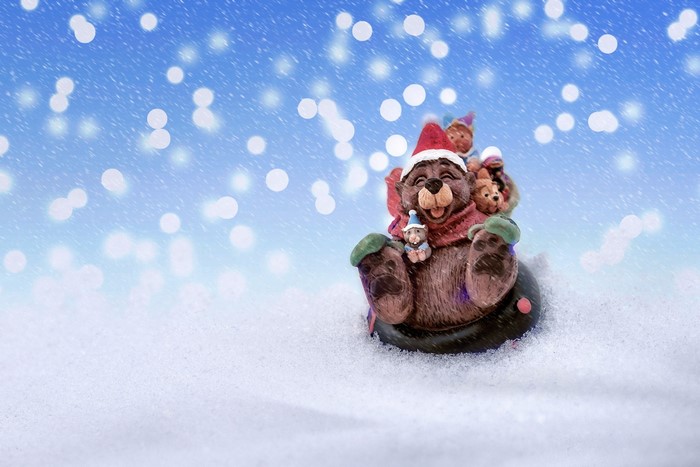 Christmas bear with gnomes in the snow