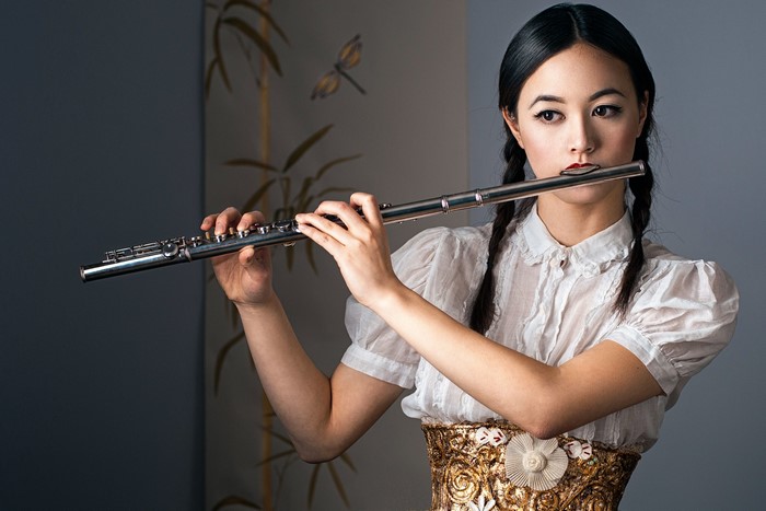 Woman playing a flute