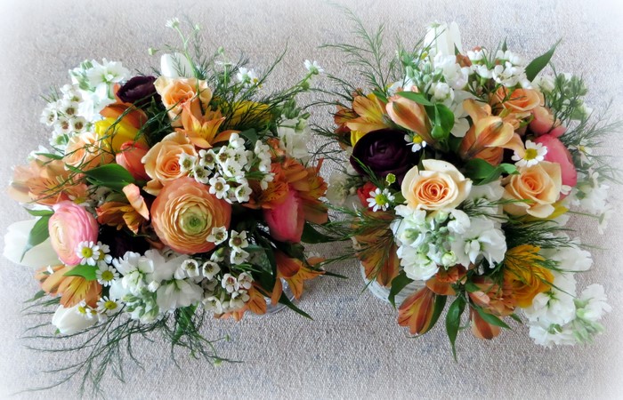 Two bouquets of flowers including roses, alstroemeria, matthiola, and ranunculus