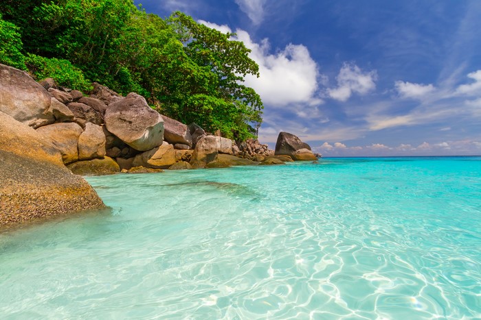 Crystal clear turquoise water and rocky coast in Thailand