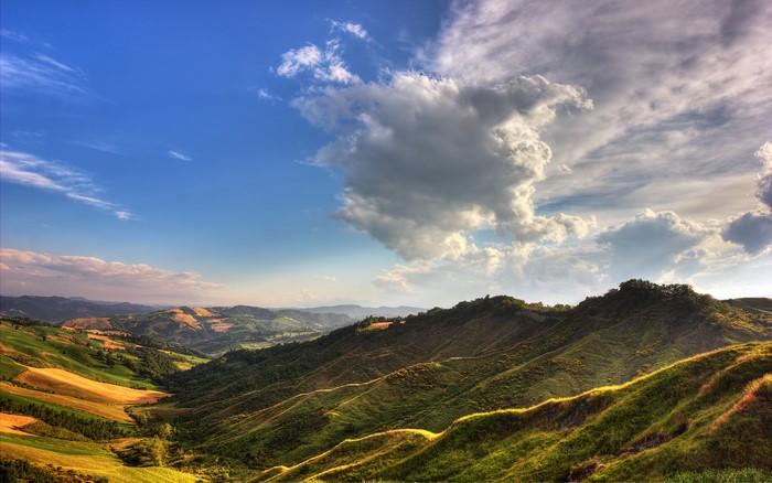 Rolling Hills and Dramatic Clouds