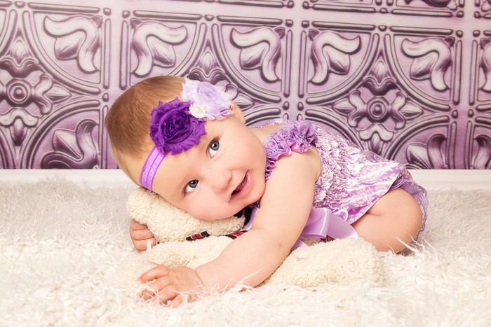 Baby girl with purple flower headband
