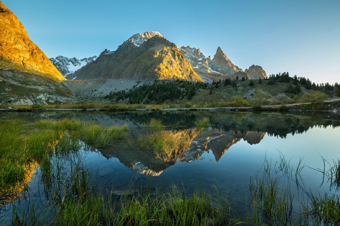 Mountains reflected in a lake at sunrise