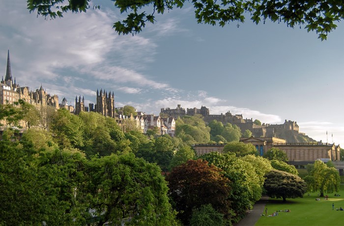 Edinburgh Castle and city skyline with trees and park