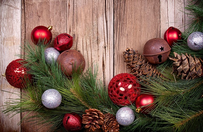 Christmas Ornaments and Pine Cones on Wood