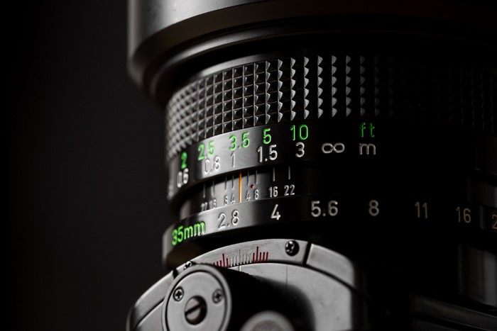 Camera lens with aperture and distance markings