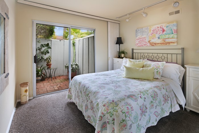 Bedroom with sliding glass door to patio