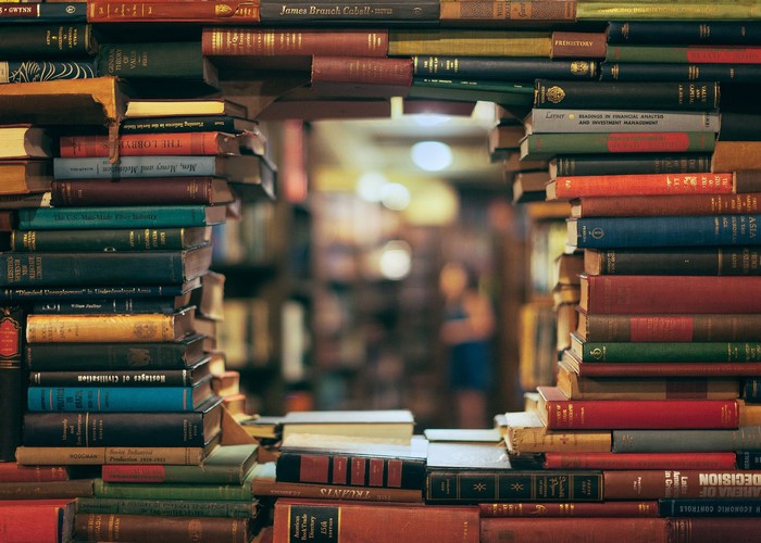 Archway Formed by Stacked Books in Library