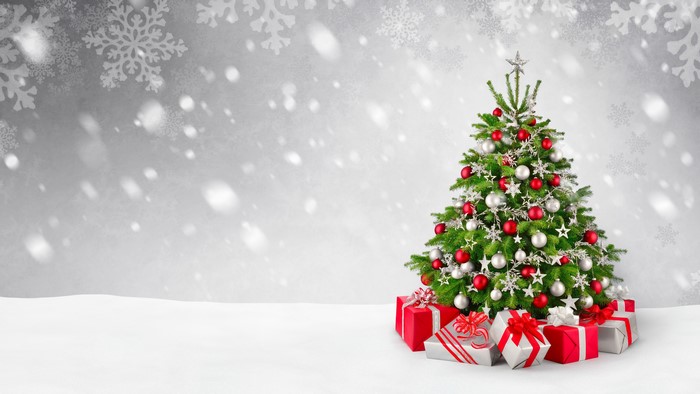 Christmas tree with gifts and snow