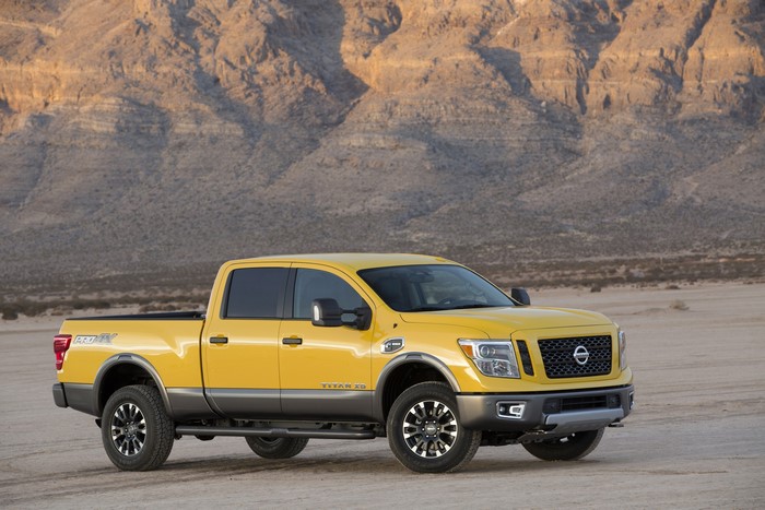 Yellow 2016 Nissan Titan XD in desert