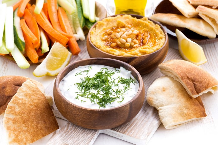 Hummus and Tzatziki Dip with Pita Bread and Vegetables