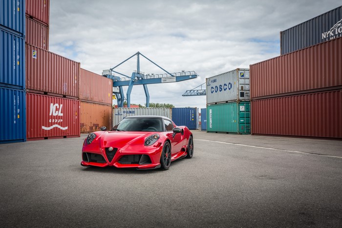 Red Alfa Romeo 4C in a Shipping Container Yard