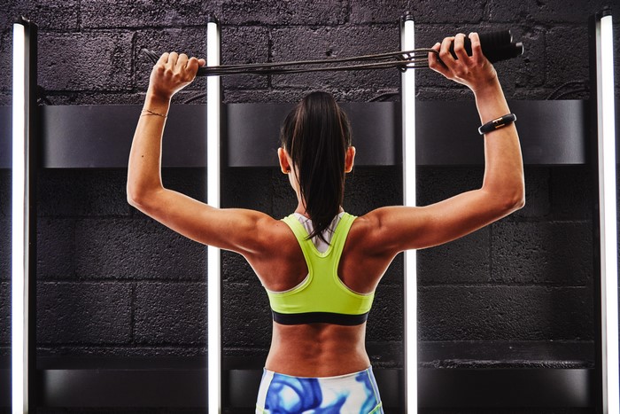 Woman exercising with resistance bands
