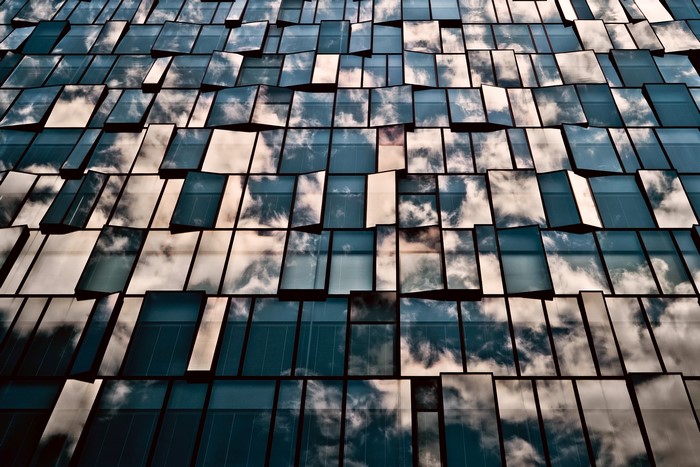 Building facade with reflective glass windows