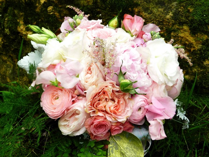 Pink and white flower bouquet with roses and ranunculus