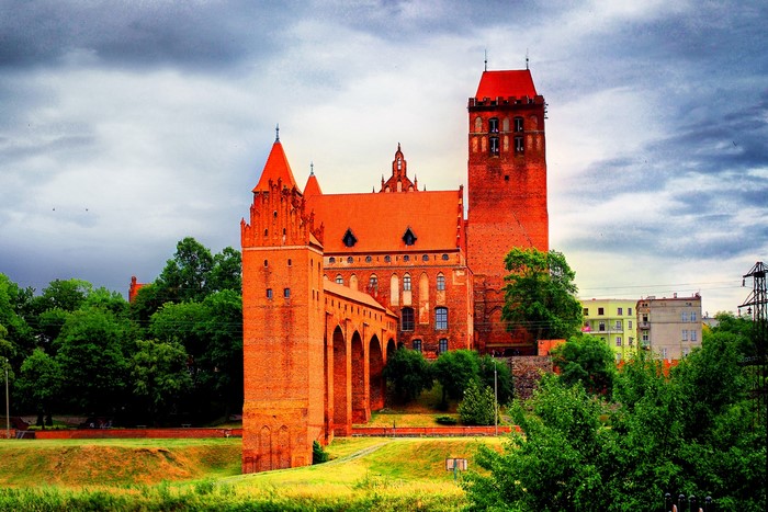 Kwidzyn Castle in Poland with trees and buildings