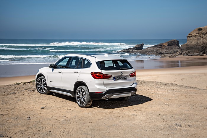 White BMW X1 xDrive xLine F48 on a Beach
