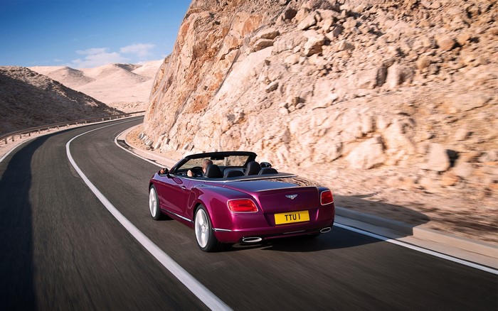 Bentley Continental GT Cabriolet driving on a desert road