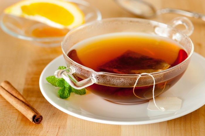 Tea with orange slice and cinnamon stick