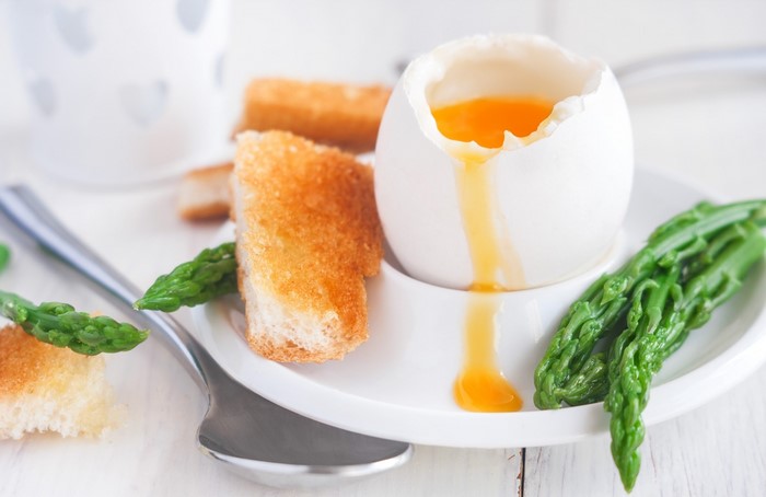 Soft-boiled egg with toast and asparagus