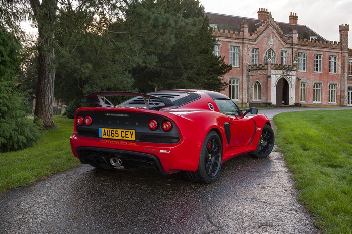 Red Lotus Exige Sport 350 parked in front of a historic building