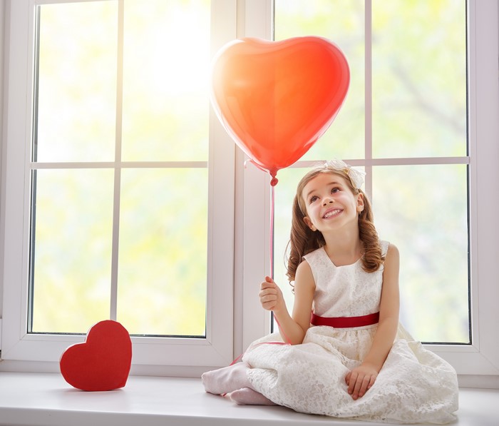 Girl with Heart Balloon by Window