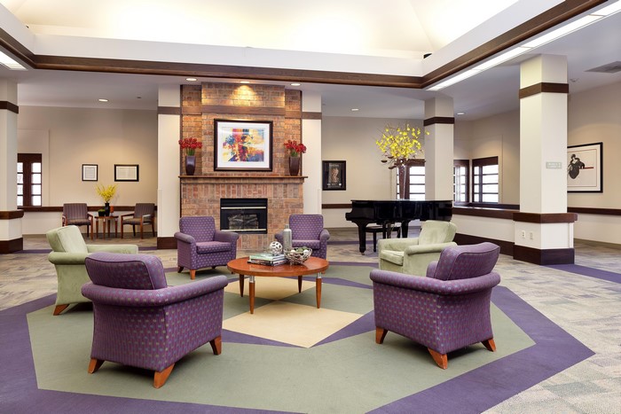 Living room with fireplace and grand piano