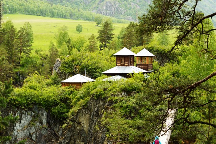 Wooden buildings on a cliffside in Russia