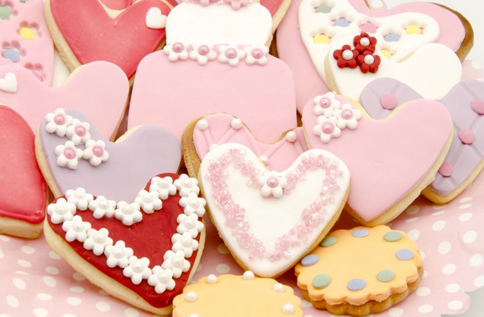 Heart-shaped cookies with frosting and decorations