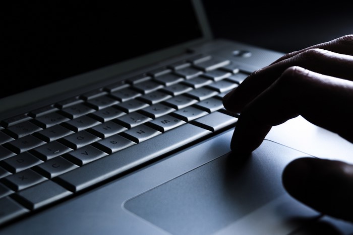 4K Closeup of Hands Typing on Laptop Keyboard