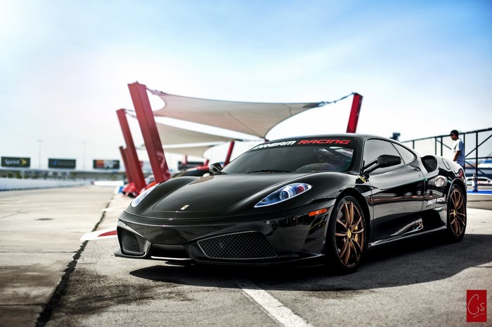 Black Ferrari 430 Scuderia on Race Track