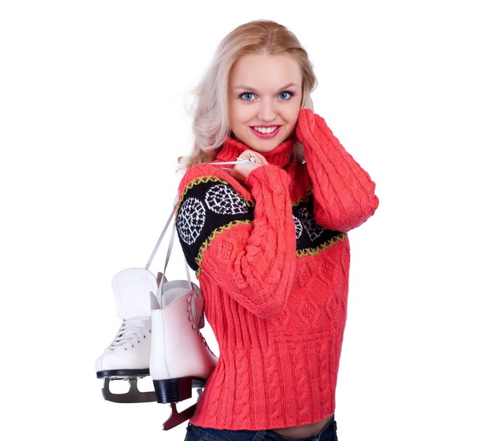 Blonde girl with ice skates