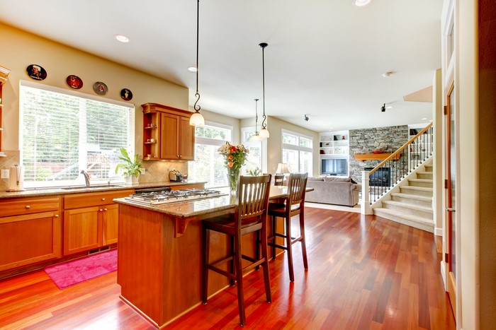 Kitchen island with chairs and open-plan living area
