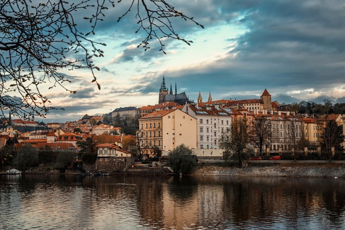 Prague cityscape with river and cathedral