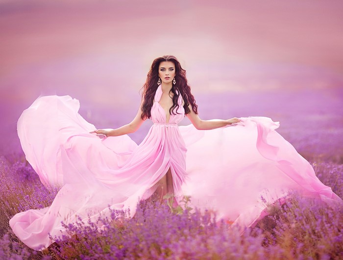 Woman in pink dress in lavender field