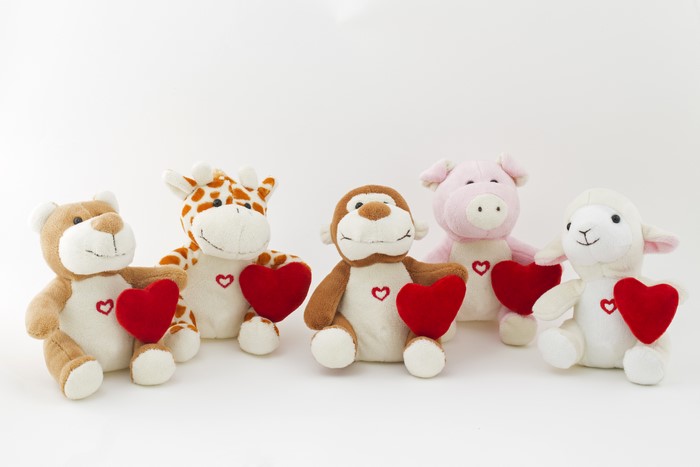 Five stuffed animals with hearts