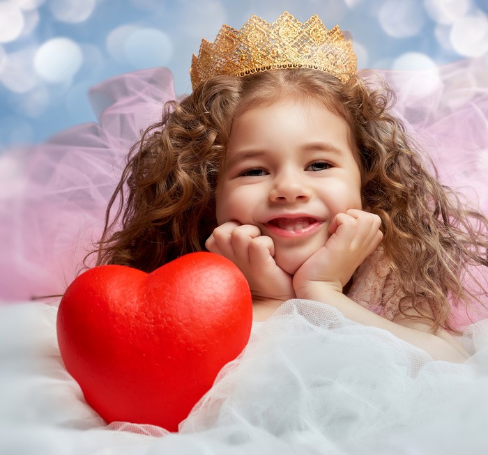 Little girl with crown and heart