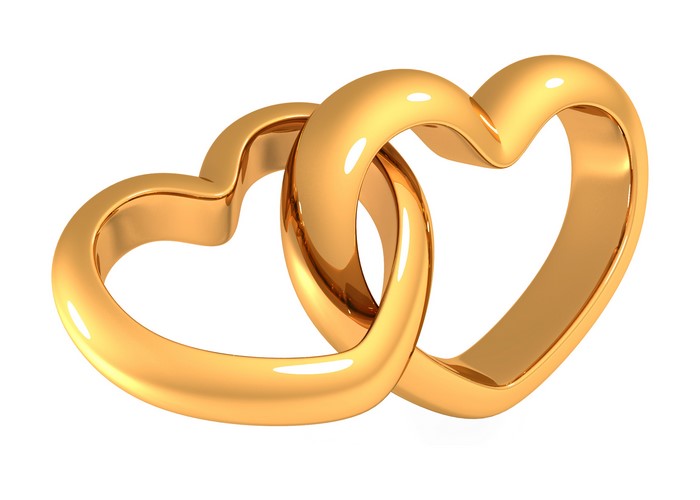 Two golden heart rings intertwined