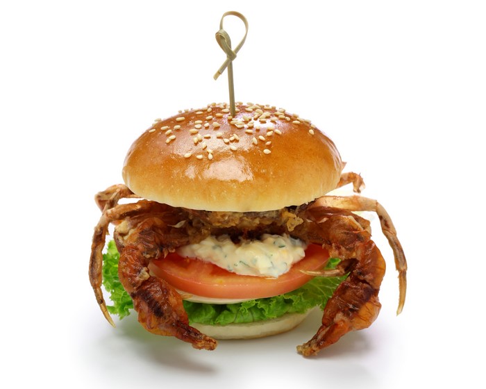 Soft shell crab burger with lettuce, tomato, and sauce
