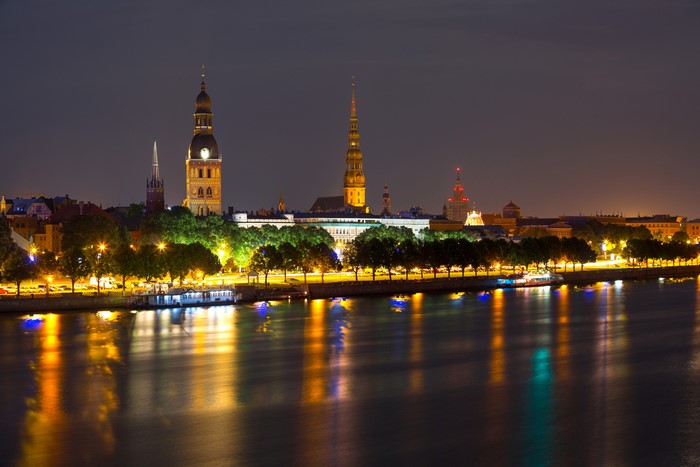 Riga, Latvia Skyline at Night with River Reflections