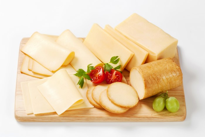 Cheese platter with tomatoes and grapes