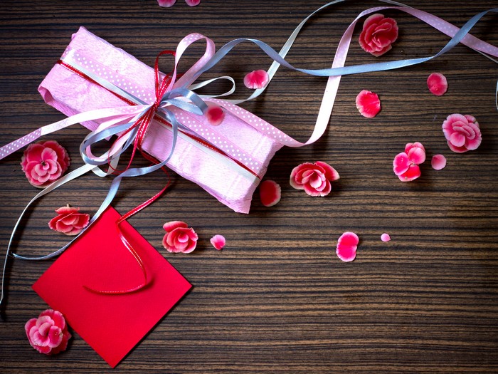 Gift with ribbons and flowers