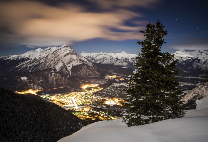 Banff National Park at night with snow-capped mountains