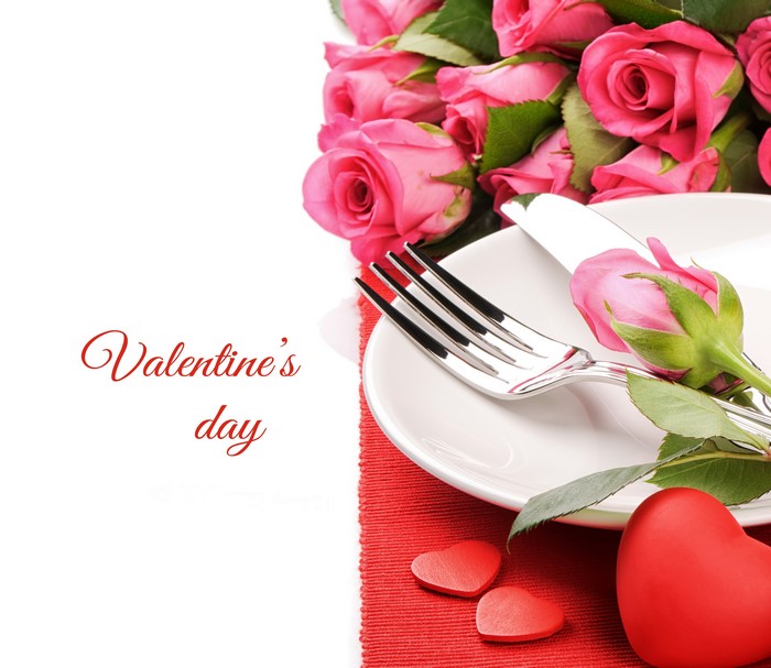 Valentine's Day table setting with pink roses and hearts