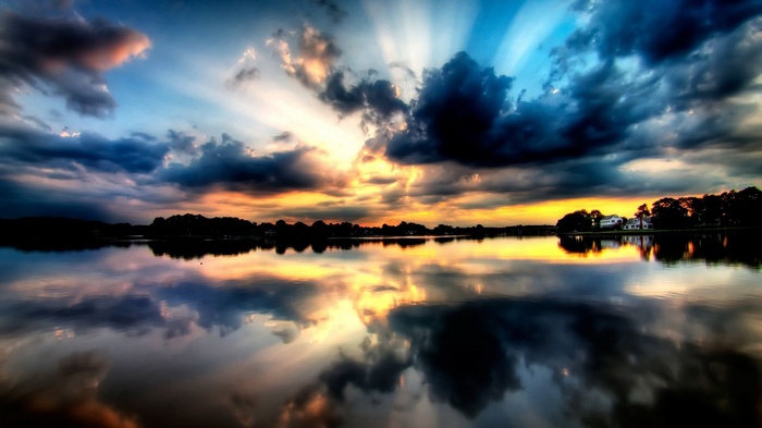 Dramatic sunset over a lake with reflections
