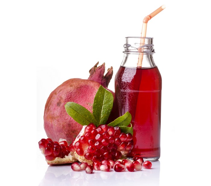 Pomegranate Juice in a Bottle with Pomegranates