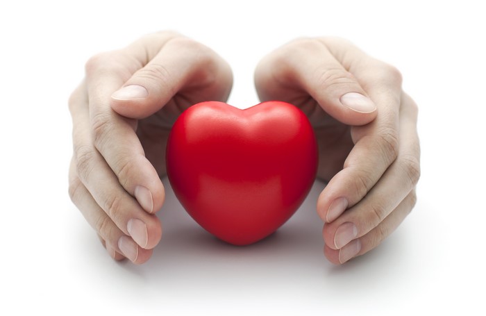 Hands holding a red heart